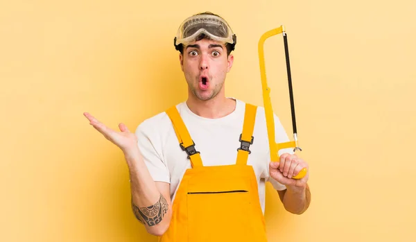 Young Handsome Man Looking Surprised Shocked Jaw Dropped Holding Object — Stock Photo, Image