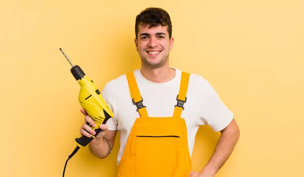 Young Handsome Man Smiling Happily Hand Hip Confident Handyman Drill — Stock Photo, Image