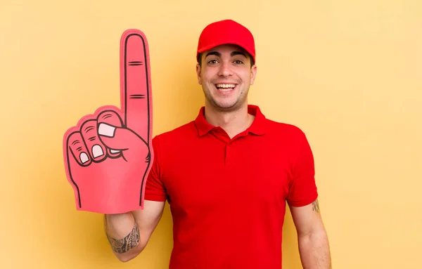 Young Handsome Man Looking Happy Pleasantly Surprised Number One Hand — Stock Photo, Image