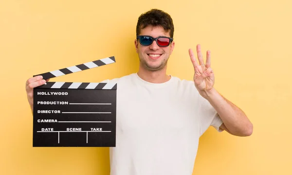 Jovem Bonito Homem Sorrindo Olhando Amigável Mostrando Número Três Cinema — Fotografia de Stock