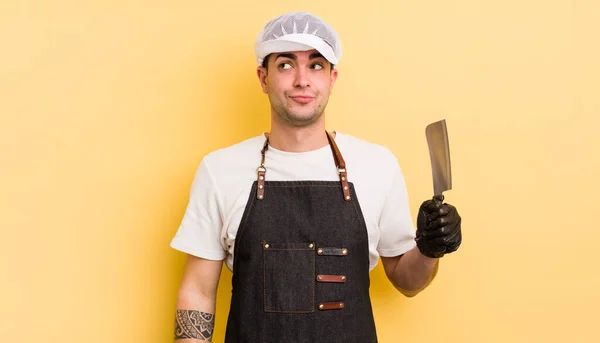 Young Handsome Man Shrugging Feeling Confused Uncertain Butcher Concept — Stock Photo, Image
