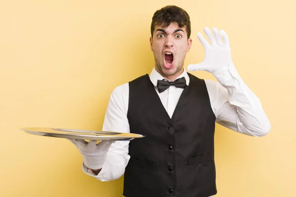 Young Handsome Man Screaming Hands Air Waiter Tray Concept — Stock Photo, Image