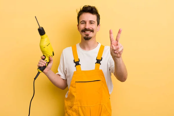 Smiling Looking Happy Gesturing Victory Peace Handyman Drill Concept — Stock Photo, Image