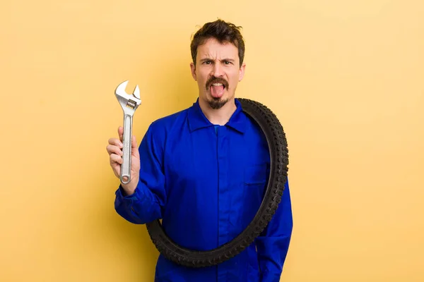 Man Feeling Disgusted Irritated Tongue Out Bike Repairman Concept — Stock Photo, Image