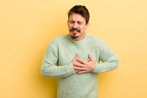 Young Hispanic Man Looking Sad Hurt Heartbroken Holding Both Hands — Stock Photo, Image