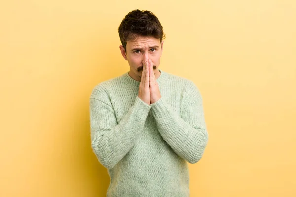 Young Hispanic Man Feeling Worried Hopeful Religious Praying Faithfully Palms — Stock Photo, Image