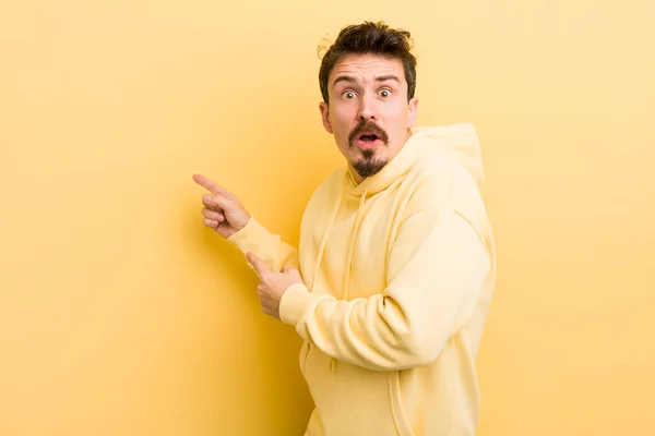 Young Hispanic Man Feeling Shocked Surprised Pointing Copy Space Side — 스톡 사진