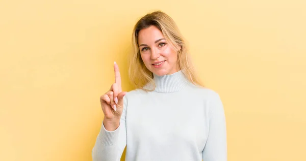 Blonde Caucasian Woman Smiling Looking Friendly Showing Number One First — Stockfoto