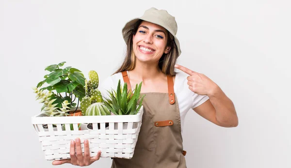 Pretty Hispanic Woman Smiling Confidently Pointing Own Broad Smile Plants — Stock Photo, Image