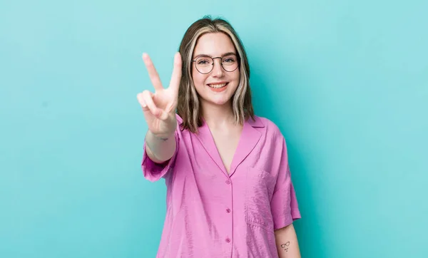 Pretty Caucasian Woman Smiling Looking Happy Carefree Positive Gesturing Victory — Stock Photo, Image