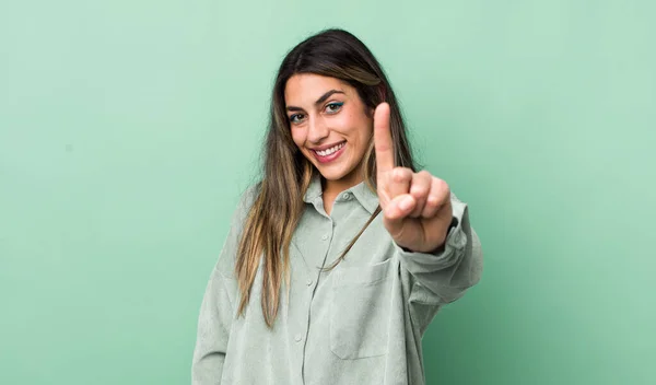 Pretty Hispanic Woman Smiling Proudly Confidently Making Number One Pose — Stock Photo, Image