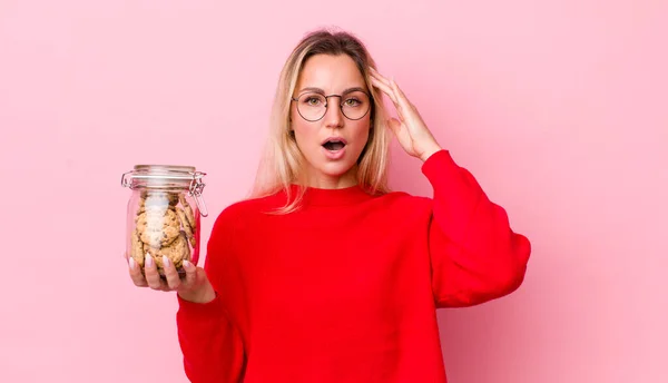 Blonde Pretty Woman Looking Happy Astonished Surprised Cookies Concept — Stockfoto
