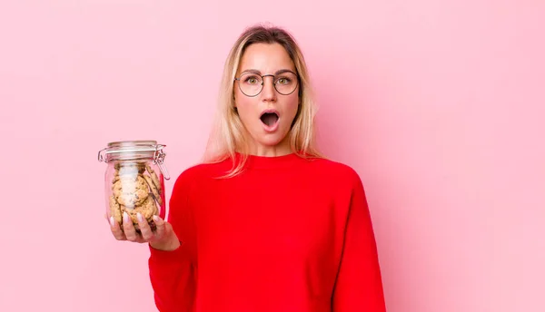 Blonde Pretty Woman Looking Very Shocked Surprised Cookies Concept — Stockfoto