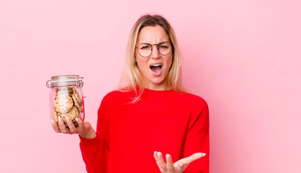 Blonde Pretty Woman Looking Angry Annoyed Frustrated Cookies Concept — Stockfoto