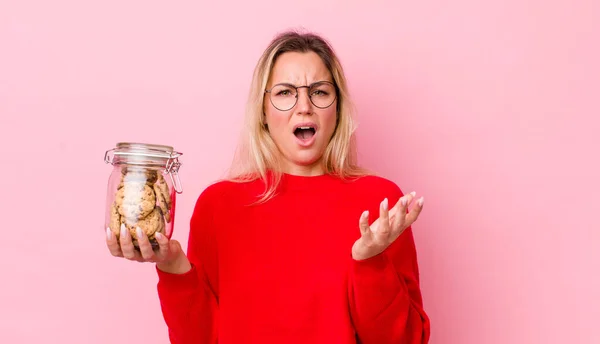 Blonde Pretty Woman Looking Desperate Frustrated Stressed Cookies Concept — Stockfoto