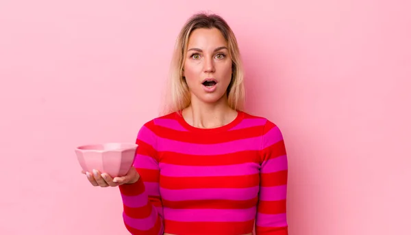 Blonde Pretty Woman Looking Very Shocked Surprised Empty Bowl Concept — Stockfoto