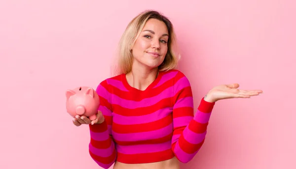 Blonde Pretty Woman Feeling Puzzled Confused Doubting Piggy Bank Concept — Stockfoto