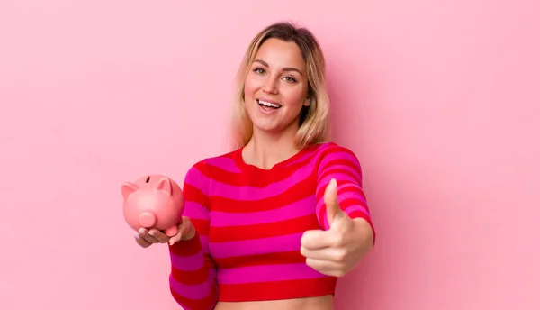 Blonde Pretty Woman Feeling Proud Smiling Positively Thumbs Piggy Bank — Stockfoto