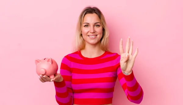 Blonde Pretty Woman Smiling Looking Friendly Showing Number Four Piggy — Stockfoto