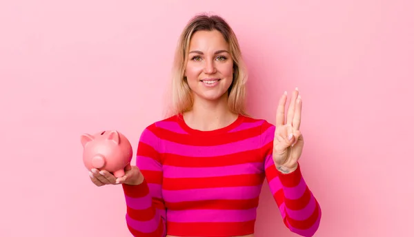 Blonde Pretty Woman Smiling Looking Friendly Showing Number Three Piggy — Stockfoto