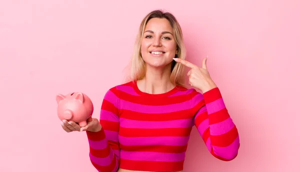 Blonde Pretty Woman Smiling Confidently Pointing Own Broad Smile Piggy — Stockfoto