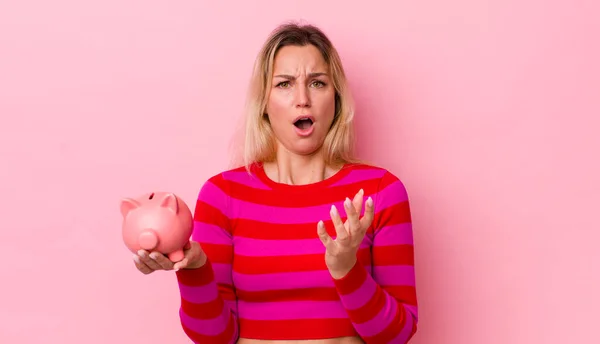 Blonde Pretty Woman Looking Desperate Frustrated Stressed Piggy Bank Concept — Stockfoto