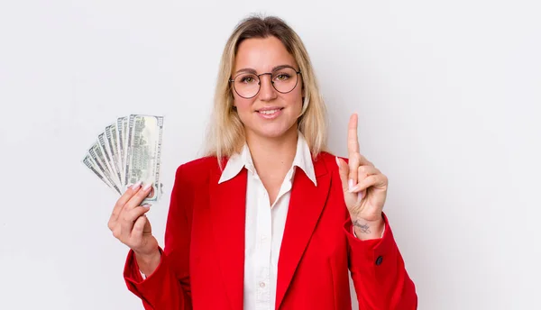 Blonde Pretty Woman Smiling Looking Friendly Showing Number One Dollar — Stock Photo, Image