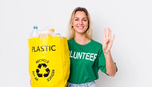 Blonde Pretty Woman Smiling Looking Friendly Showing Number Four Recycle — Stock Photo, Image