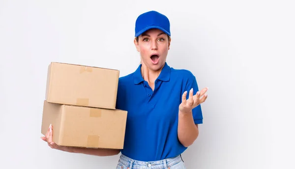 Blonde Pretty Woman Feeling Extremely Shocked Surprised Shipping Boxes Concept — Stockfoto