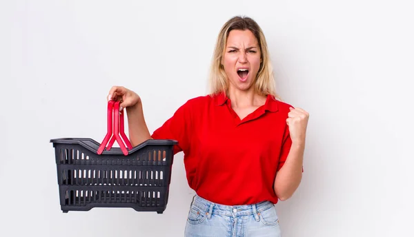 Blonde Pretty Woman Shouting Aggressively Angry Expression Shopping Basket Concept — ストック写真
