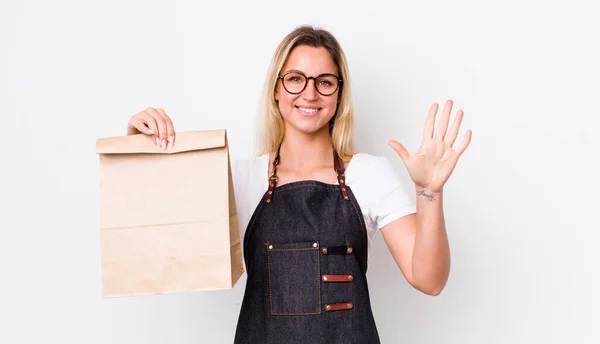 Blonde Pretty Woman Smiling Looking Friendly Showing Number Five Delivery — Stock Photo, Image