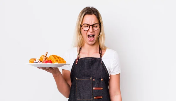 Blonde Pretty Woman Shouting Aggressively Looking Very Angry Waffles Concept — Stockfoto