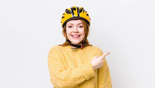 Red Head Pretty Woman Looking Excited Surprised Pointing Side Cycling — Stock Photo, Image