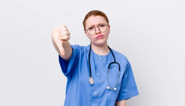 Red Head Pretty Woman Feeling Cross Showing Thumbs Nurse Concept — Stock Photo, Image