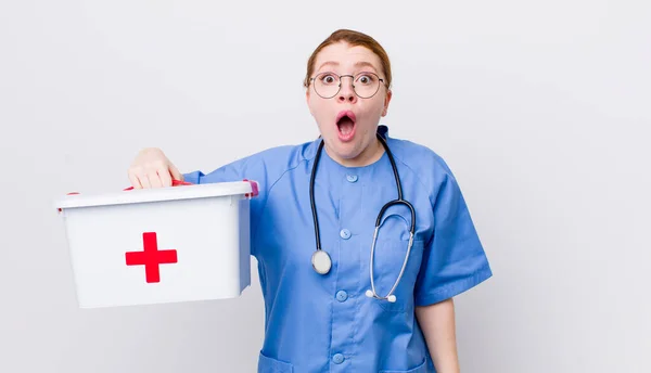 Red Head Pretty Woman Looking Very Shocked Surprised Nurse Concept — Stock Photo, Image