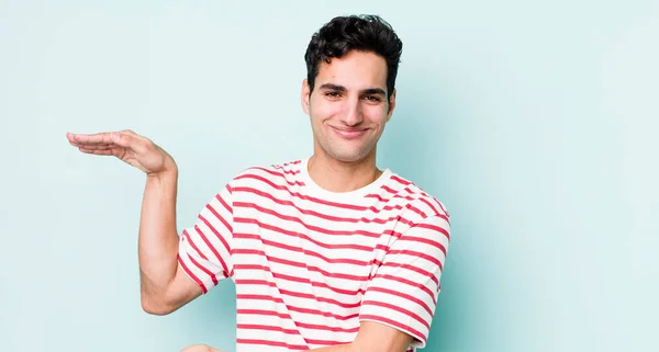 Handsome Hispanic Man Holding Object Both Hands Side Copy Space — Stock Photo, Image