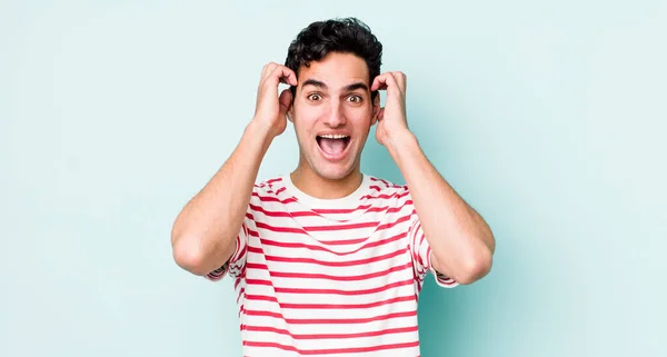 Handsome Hispanic Man Raising Hands Head Open Mouthed Feeling Extremely — Stock Photo, Image