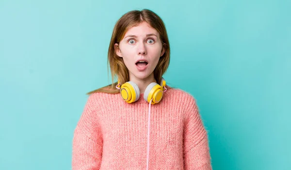 Red Head Pretty Woman Looking Very Shocked Surprised Headphones Music — Foto de Stock
