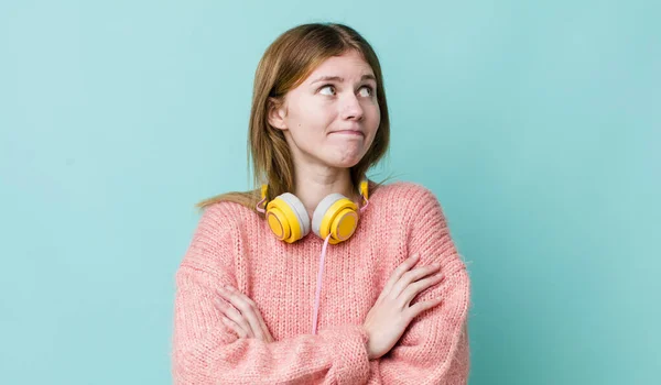 Red Head Pretty Woman Shrugging Feeling Confused Uncertain Headphones Music — Foto de Stock