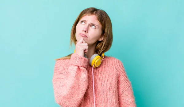 Red Head Pretty Woman Thinking Feeling Doubtful Confused Headphones Music — Foto de Stock
