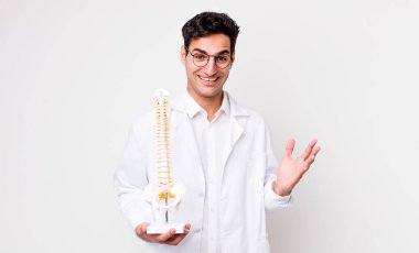 handsome hispanic man feeling happy, surprised realizing a solution or idea. spine specialist concept clipart