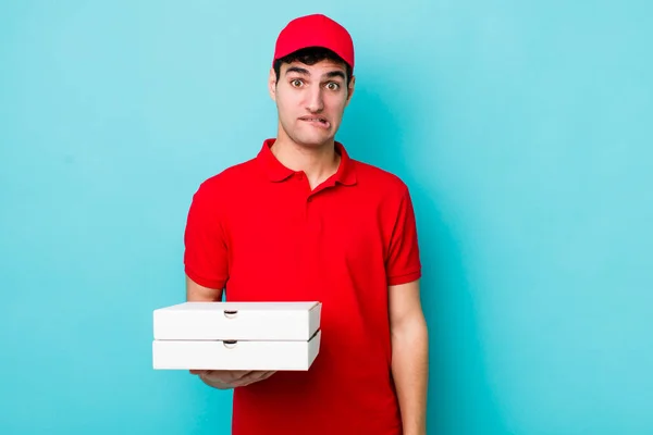 Handsome Hispanic Man Looking Puzzled Confused Delivery Pizza Concept — Stock Photo, Image