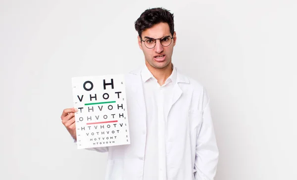 Handsome Hispanic Man Feeling Puzzled Confused Optical Vision Test Concept — Stock Photo, Image