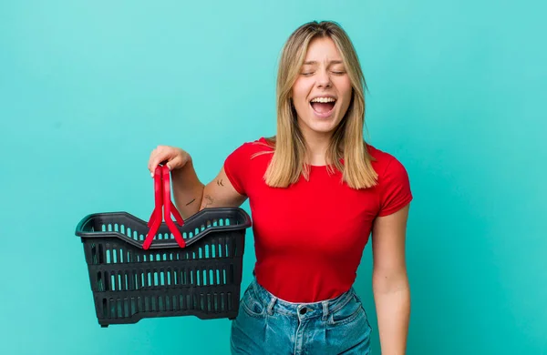Pretty Blonde Woman Shouting Aggressively Looking Very Angry Shopping Basket — ストック写真