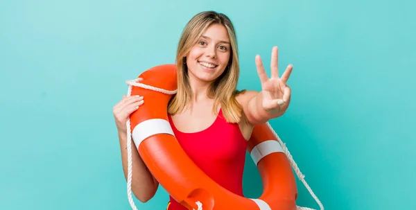 Pretty Blonde Woman Smiling Looking Friendly Showing Number Three Lifeguard — Stock Photo, Image