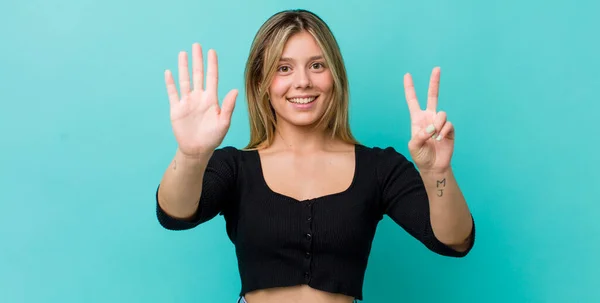 Young Pretty Blonde Woman Smiling Looking Friendly Showing Number Seven — Stock Photo, Image