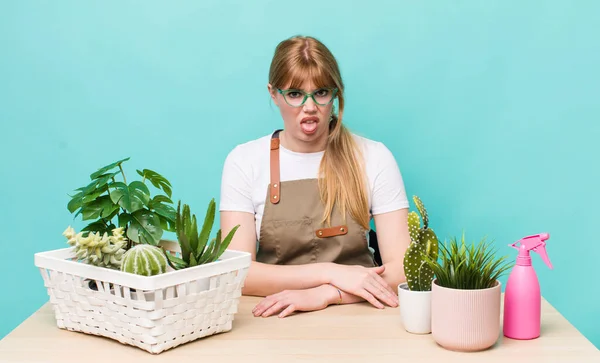 Red Head Pretty Woman Feeling Disgusted Irritated Tongue Out Plants — ストック写真