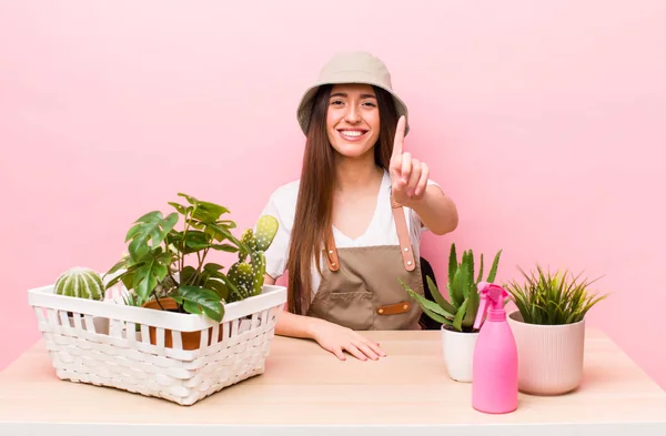 Hispanic Pretty Woman Smiling Proudly Confidently Making Number One Plants — 스톡 사진