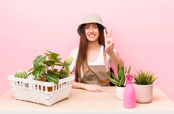 Hispanic Pretty Woman Smiling Looking Friendly Showing Number Two Plants — 스톡 사진