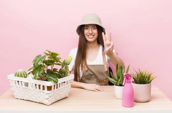 Hispanic Pretty Woman Smiling Looking Friendly Showing Number Three Plants — 스톡 사진